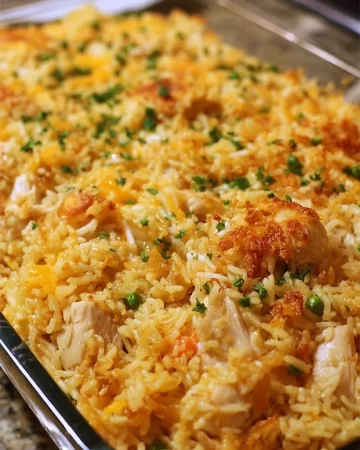 Delicious Million Dollar Chicken Rice-A-Roni Casserole topped with melted cheese
