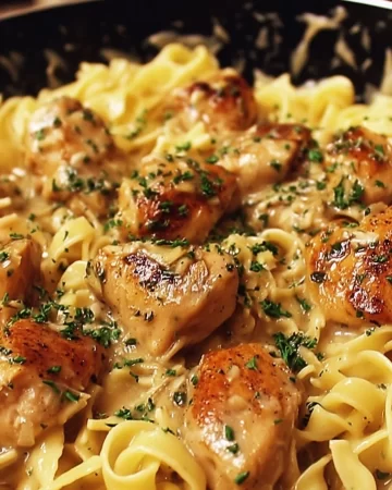 One-pan creamy garlic butter chicken with egg noodles in a skillet