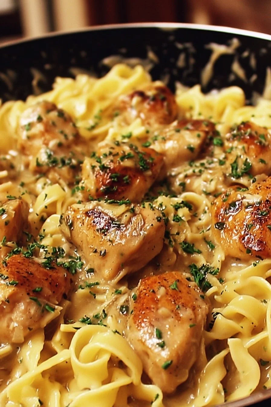 One-pan creamy garlic butter chicken with egg noodles in a skillet