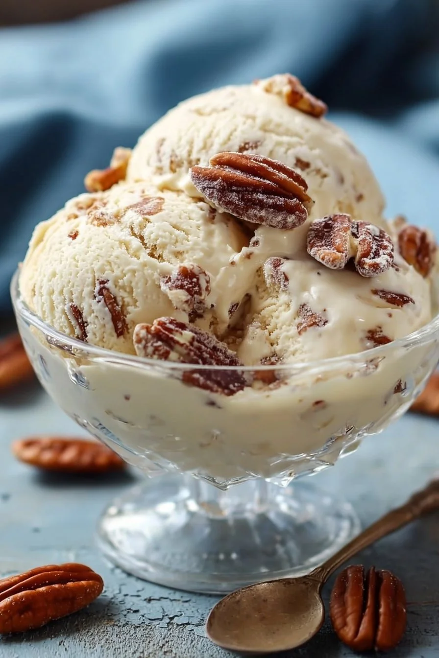 Delicious homemade butter pecan ice cream topped with roasted pecans