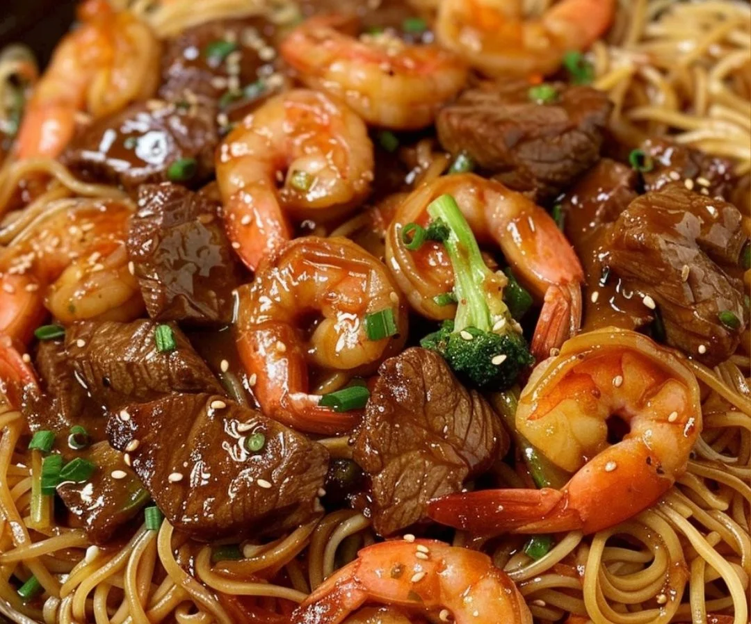 Shrimp Teriyaki Steak Noodles garnished with vegetables in a bowl