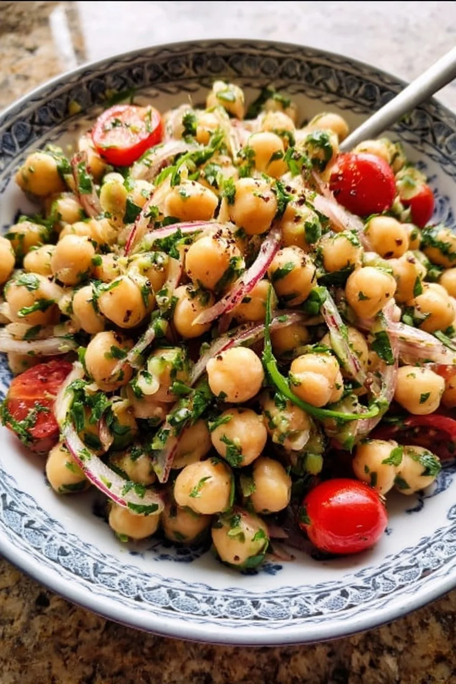 Healthy chickpea salad with fresh herbs and scallions in a bowl