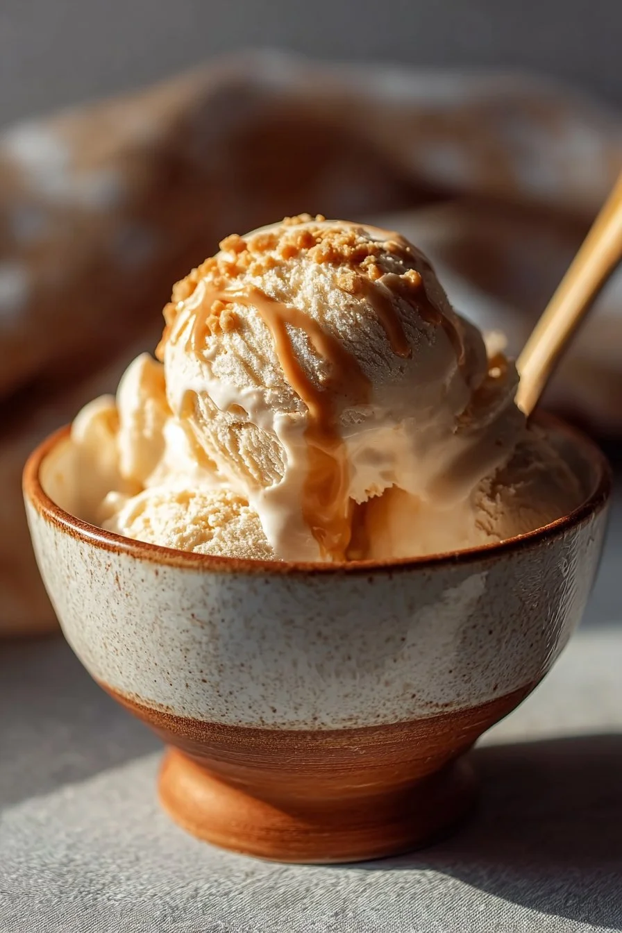 Creamy Peanut Butter Greek Frozen Yogurt served in a bowl with a spoon
