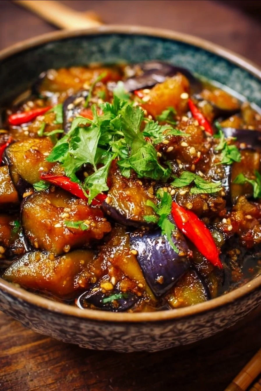 Hearty Chinese eggplant in garlic sauce garnished with fresh herbs