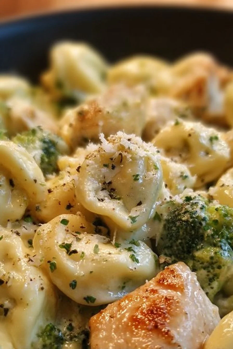 Creamy garlic parmesan tortellini with chicken and broccoli in a bowl