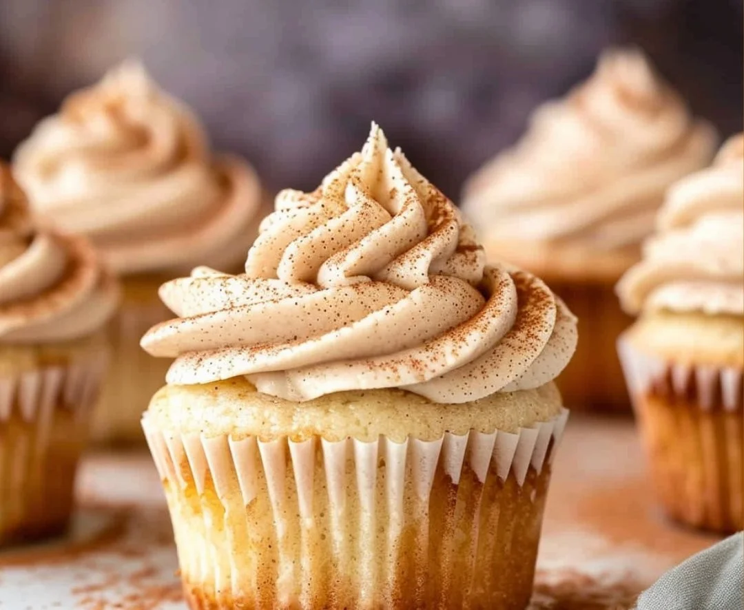 Delicious churro cupcakes topped with cinnamon sugar frosting