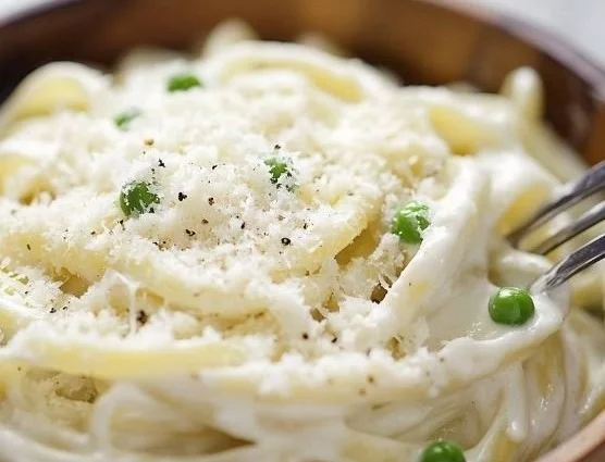 Creamy cottage cheese pasta sauce served over spaghetti with herbs.
