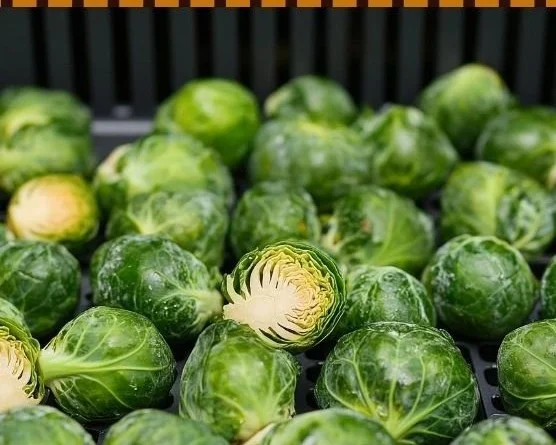 Crispy Air Fryer Brussels sprouts served on a plate with seasoning