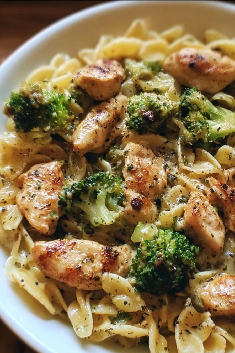 Delicious bowl of chicken broccoli pasta with garlic and parmesan cheese