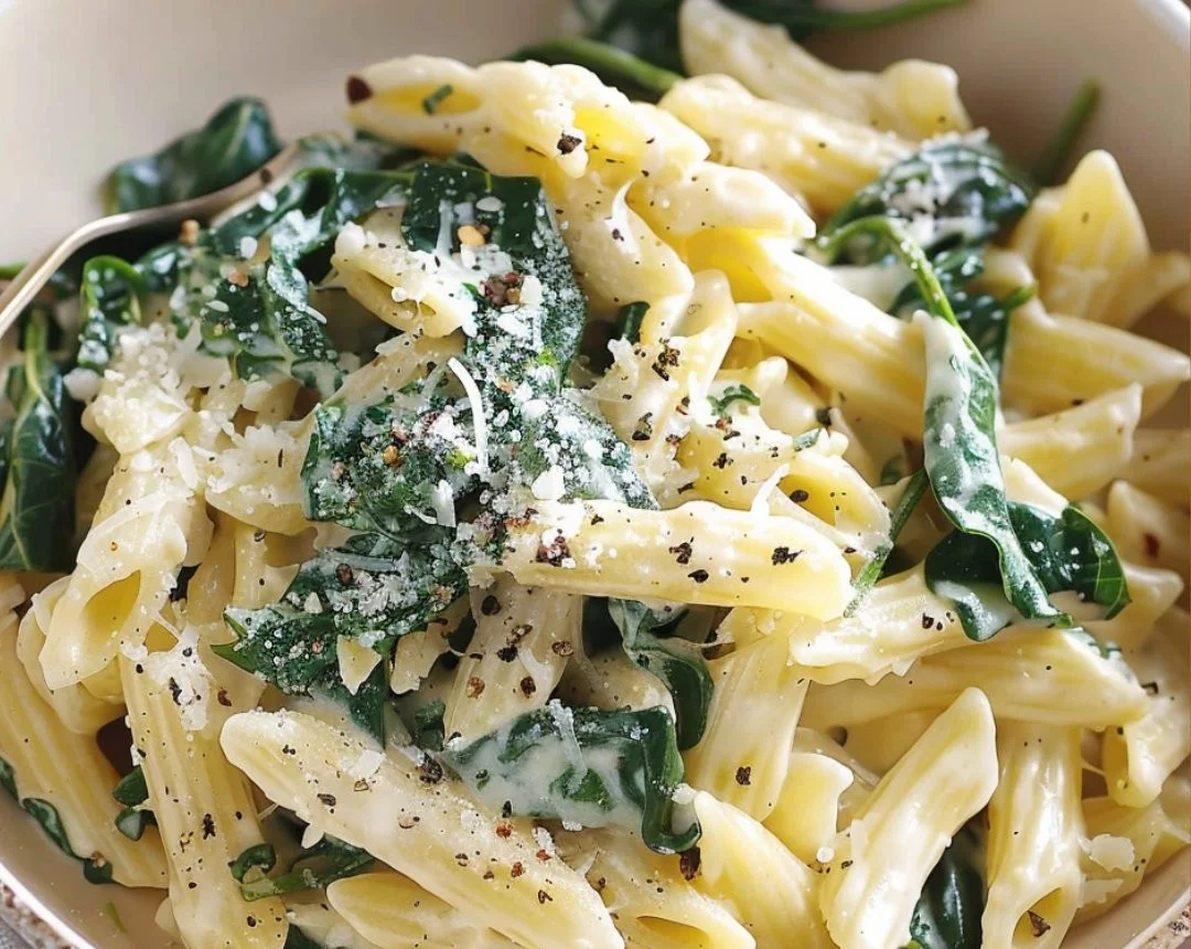 Delicious Pasta con Spinaci with fresh spinach and savory sauce