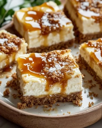 Delicious caramel apple cheesecake bars with a golden crust and drizzled caramel